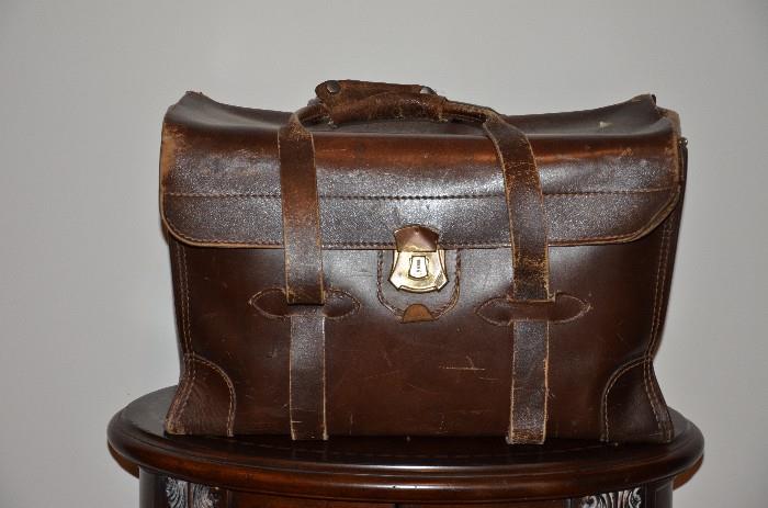 There are 2 of these accountant's bags. Like an old seasoned doctor's bag these can be a real prize. Only one owner this bag has seen many miles and many court rooms. One is in better shape than the other. This is a picture of the greater loved case. $40