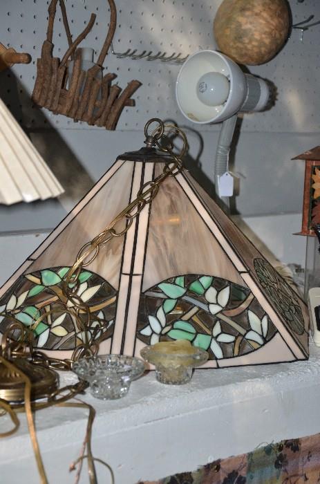 This lovely light fixture was recently replaced with a different style light for a change in a morning room. This is still a pretty light. The leaded glass shade casts dappled shadows on the wall in the dark of evening. Sunday's price $45.00
