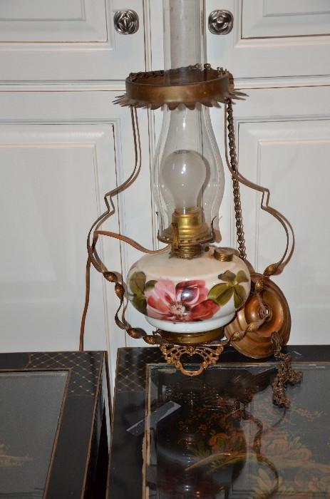 Need a project ... this electrified lamp needs some cleaning and a new shade. The design replicates an old kerosene lamp. Nice painted base. Find the right shade and you've created a very lovely lamp. Sunday price $25.