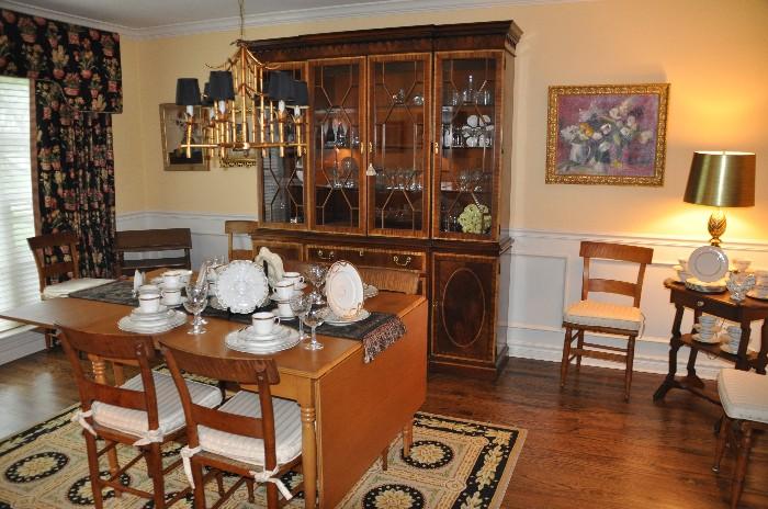 Wonderful dining room filled with vintage Haviland Limoges china sitting atop of a fantastic drop leaf table with 6 chairs
