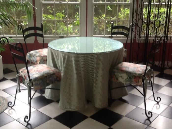 Glass top table with four chairs - fabric included.