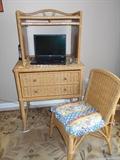 wicker desk unit, top piece has door that pulls down to cover