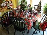 4 black painted chairs, and various Christmas decor