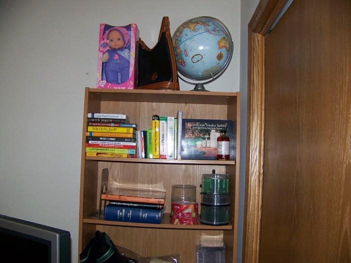 Bookcase, globe, books and office supplies