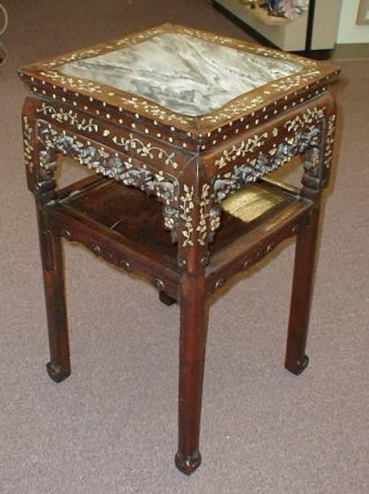 19th Century Chinese table.  Marble top.  Carved and inlaid with mother of pearl