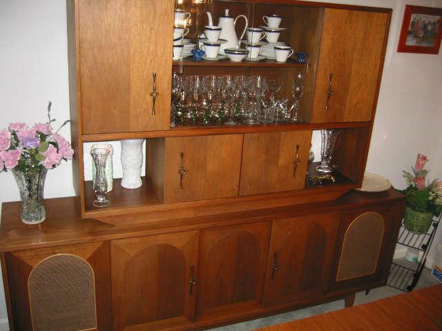 mid century breakfront with sliding lighted bar area