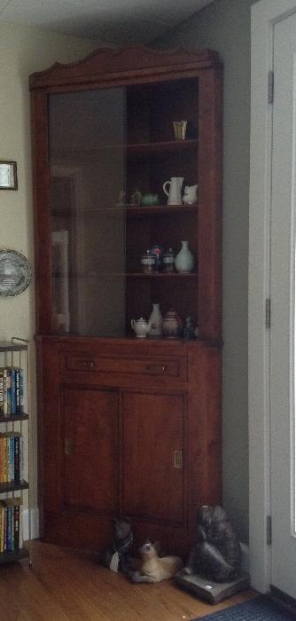 Corner cabinet with sliding glass doors