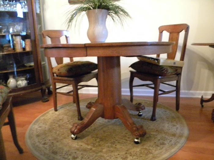 Lovely Antique Claw Foot Pedestal Table with 2 leaves and 8 Chairs