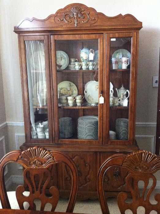     china cabinet has matching table, chairs, & server