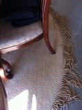            good - looking round rug with bullion fringe