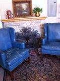            2 blue leather wingback chairs/ faux fire place/great fire screen