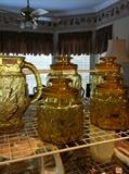                   gold colored pitcher & canister set
