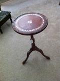     1 of several small leather top tables/plant stands