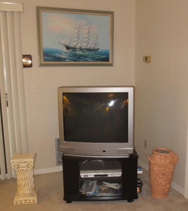 Toshiba TV on stand with K. Maskell clipper ship oil painting behind it