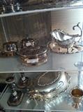 large selection of silver plate serving pieces