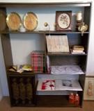 This bookcase/display unit is approximately 5' high x 4 1/2' wide...bottom shelf has sliding door (on left).