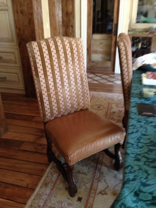 Dining chair upholstered in fabric and saddle leather.  Part of dining set, there are 4