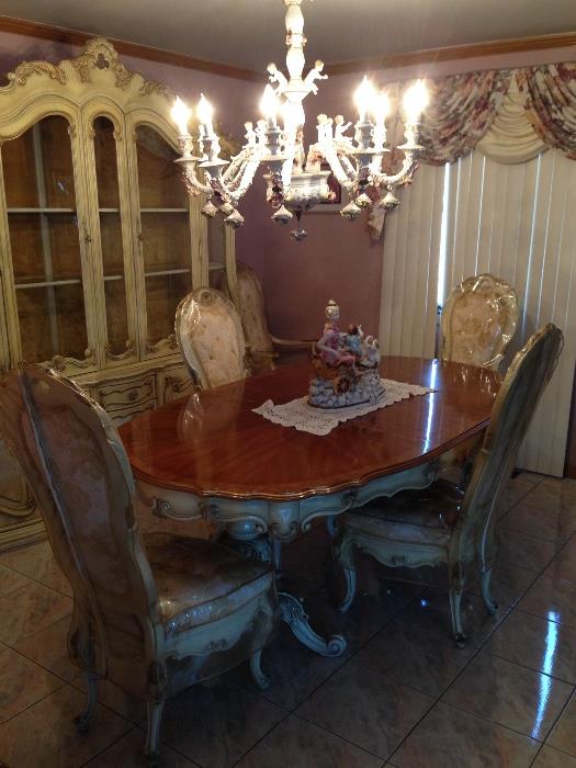 Italian style dining set with 6 chairs, all of which have been covered in plastic - pristine condition!