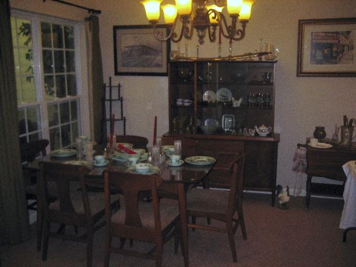 Danish modern table and chairs and china cabinet.  Lots of glassware.