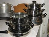 six piece "canring" cookware. Four pots, one skillet, one saucepan all with lids
