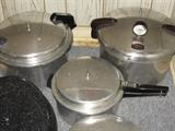 three pressure cookers [presto, mirror magic, mirror]