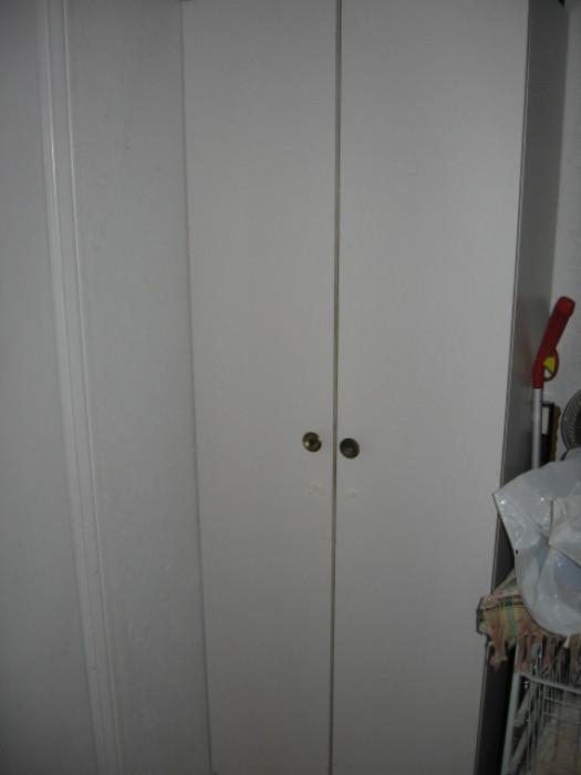 one of two matching storage cabinets