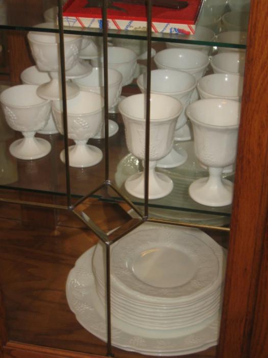 vintage matching milk glass dishes. 8 plates, 8 saucers, 8 tumblers [Tea glasses], 8 small milk glasses, 1 pitcher, 2 fruit bowls, 2 candle holders, to candy jars [1 with Lee Ed], two vases, 8 sherbet bowls, 8 ice cream bowls, 8 cups, 8 wineglasses, and 4 Sherry glasses