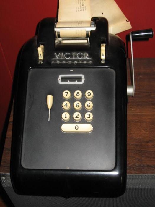 antique Victor champion adding machine, works with original softcover