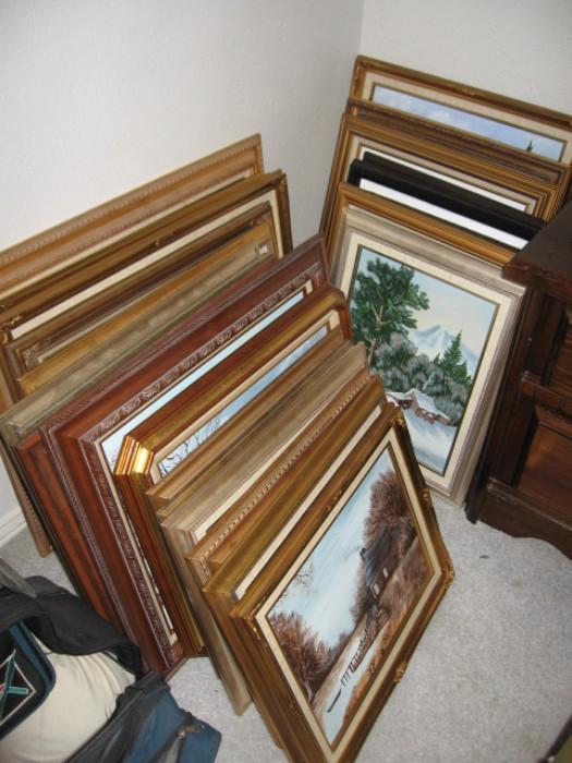 Assortment of canvas oil paintings mounted in frame