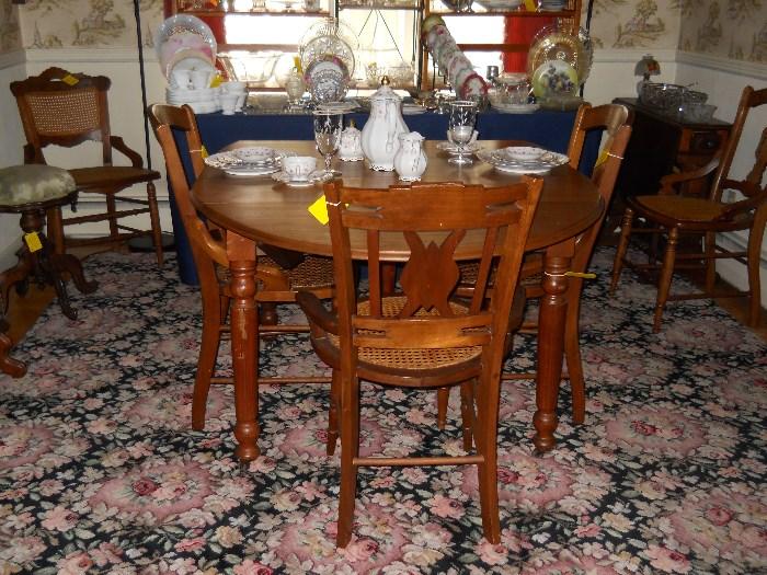 drop leaf dining room table w/ 2 leaves, assorted chairs, dinnerware, etc.