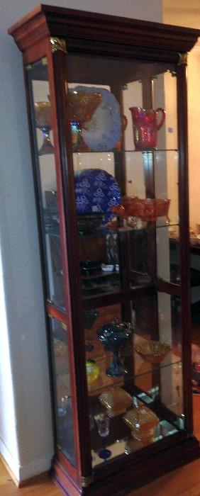 Curio cabinet with carnival glass