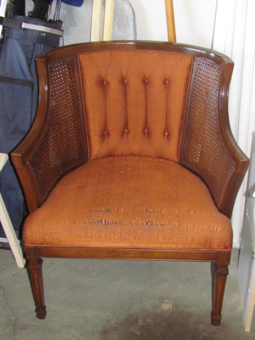 One of two Mid Century Cane and Upholstered Chairs