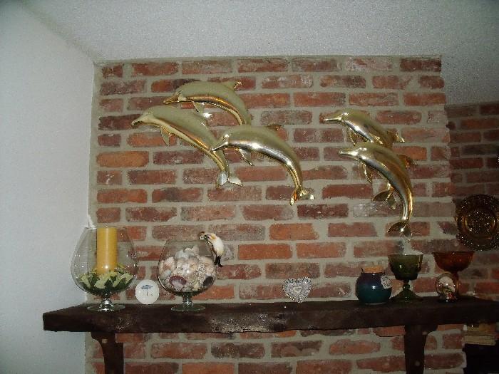 Plastic brass look dolphins