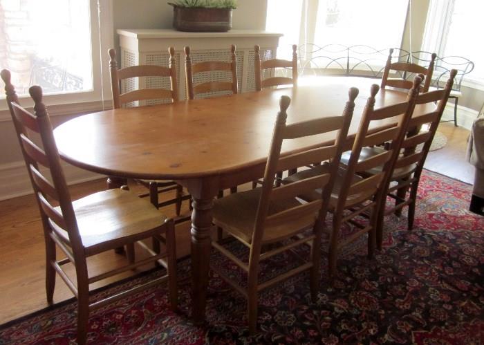Extra long Knotty Pine dining table (Crate and Barrel) and 8 ladder-back chairs (Amish made)