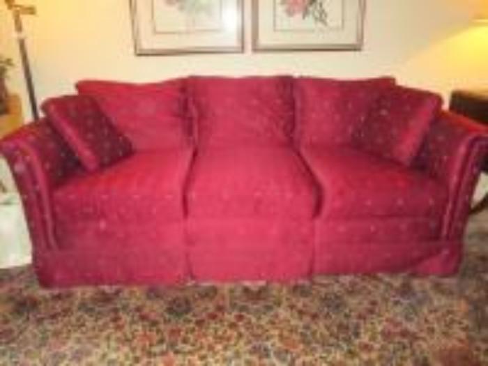 Sofa -Material appears to be a silk or stain blend & merlot color 