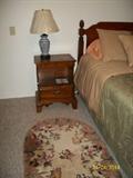 nite stand , lamp and butterfly rug