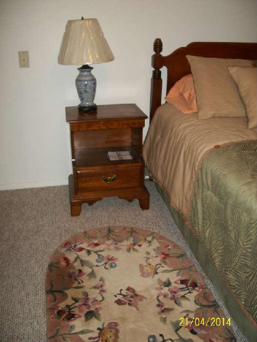 nite stand , lamp and butterfly rug