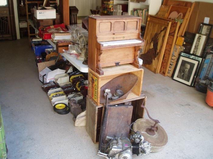Schoenhut piano, paper cutter, grinding stone, advertising boxes