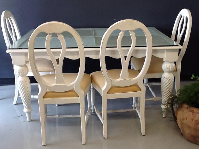 Lexington furniture breakfast table  with 4 side chairs, wicker inset top with glass covering it.