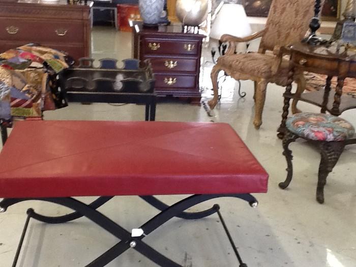 Black Crisscross based ottoman with red leather top. Victorian crazy quilt, iron 3 legged metal stool,3 drawer night table 