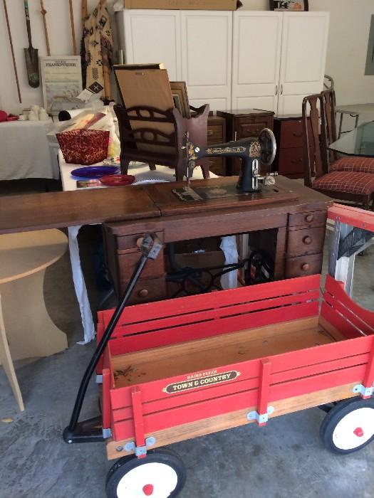 red wagon, antique Singer sewing machine in cabinet