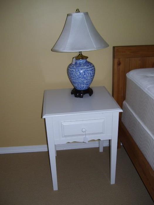 Pair of white painted bedside tables 