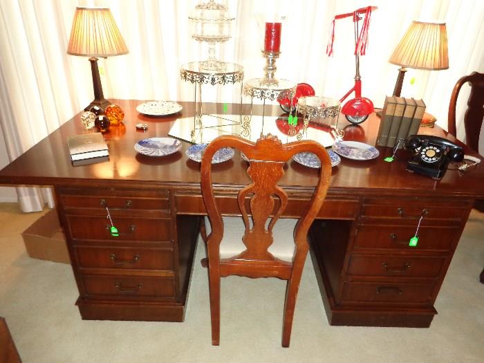 Large executive desk, pair of lamps, blue & white plates, collection of glass balls, red scooter, glass-topped silver plate cake display stands, vintage rotary dial phone