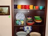 Dark wood book case, Fiesta ware, blue & white serving pieces