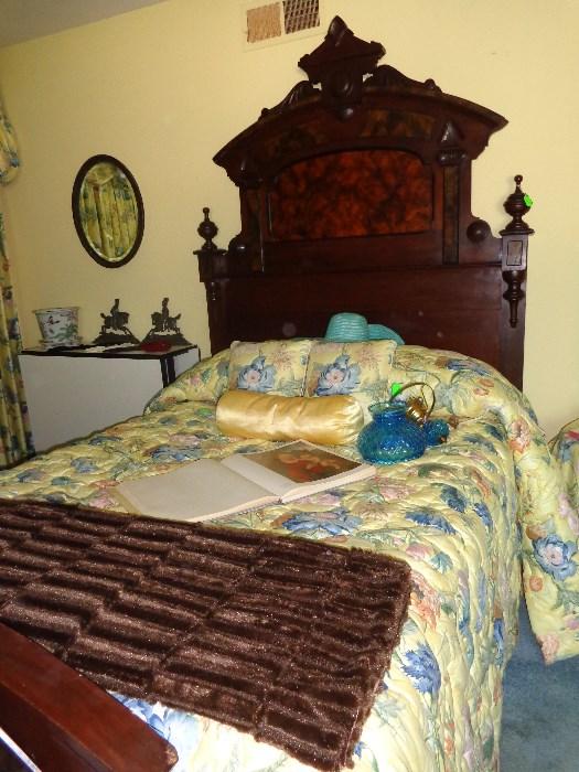 Antique Lincoln bed and dresser, carved with burl wood inlay; faux fur throw, vintage blue glass wall lamp, king-size comforter