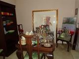Antique mahogany table with ball & claw feet, six chairs with Queen Ann legs, over-sized framed floral, original work by Ann Cushing, china