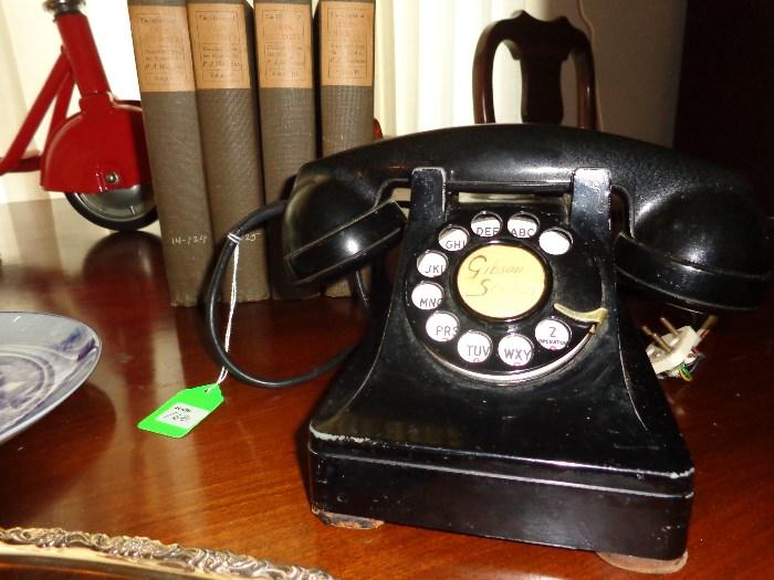 Vintage rotary dial phone with fabric-covered cord