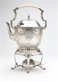 Lot# 1012 A German .800 silver tipping kettle Late 19th / early 20th century, the kettle hallmarked to base, maker's mark of Bruckmann and Sohne, the stand and burner not marked, of oval form, the finial, hinged lid and body partially gadrooned, the body decorated on each side with an oval cartouche suspended by bowknot-tied laurel garlands, with a swing handle, the stand with shell-headed scrolled legs, holding a gadrooned burner, overall with handle up 15.25'' H x 10'' W x 6'' D, gross weight 64.3 oz troy approximately, est: $1000/2000