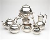 Lot# 1014 A sterling silver tea & coffee service, Ball, Black & Co Circa 1851 - 1876, marked ''Ball, Black & Co / New York / English Sterling'' and with pattern number ''465'', comprising: a hot water urn on stand (overall 13.75''H x 8.5''W x 11''D), a coffee pot (9''H x 8''W x 5.25''D), a teapot (6''H x 9''W x 5.5''D), a covered sugar bowl (5.25''H x 7''W x 5.25''D), a milk jug (4.75''H x 4.75''W x 4''D), and a waste bowl (4''H x 5''Dia.), not monogrammed, 6 pcs, gross weight 151.7 oz troy tw approximately, est: $4000/6000