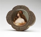 Lot# 1034 A Continental gilt & patinated metal & porcelain box
  
Late 19th / early 20th century, of quatrefoil form, the hinged cover relief-cast with flowers and foliage, centering an inset circular porcelain plaque, signed 'Wagner', hand-painted with a portrait of ''Una Gitana'' (A Gypsy) after Asti, the sides cast with foliate and scroll bands, the interior lined with later gold damask, 2'' H x 6'' W x 5.25'' D, est: $600/800